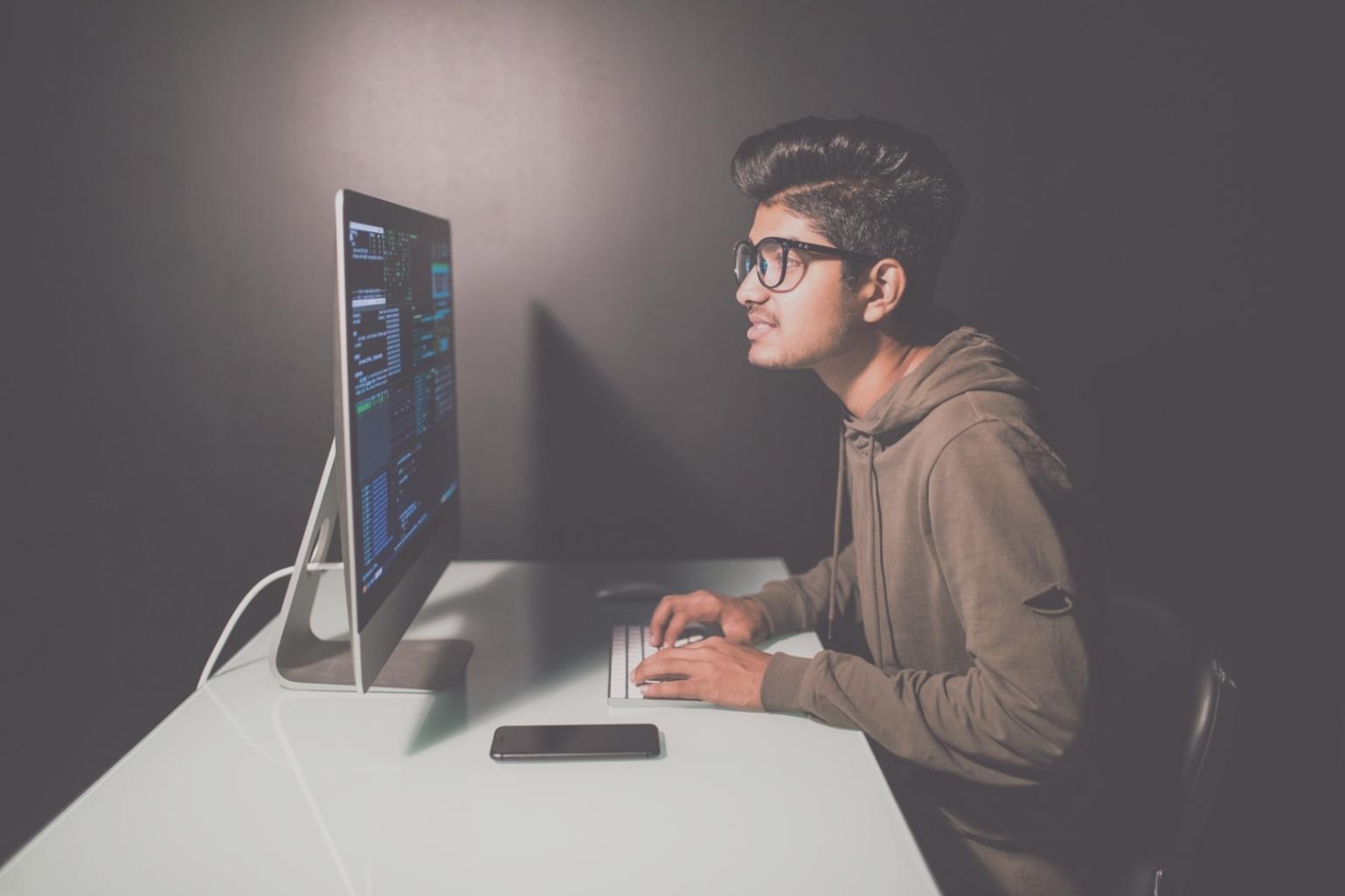 Mobile app development workspace showing code and design elements